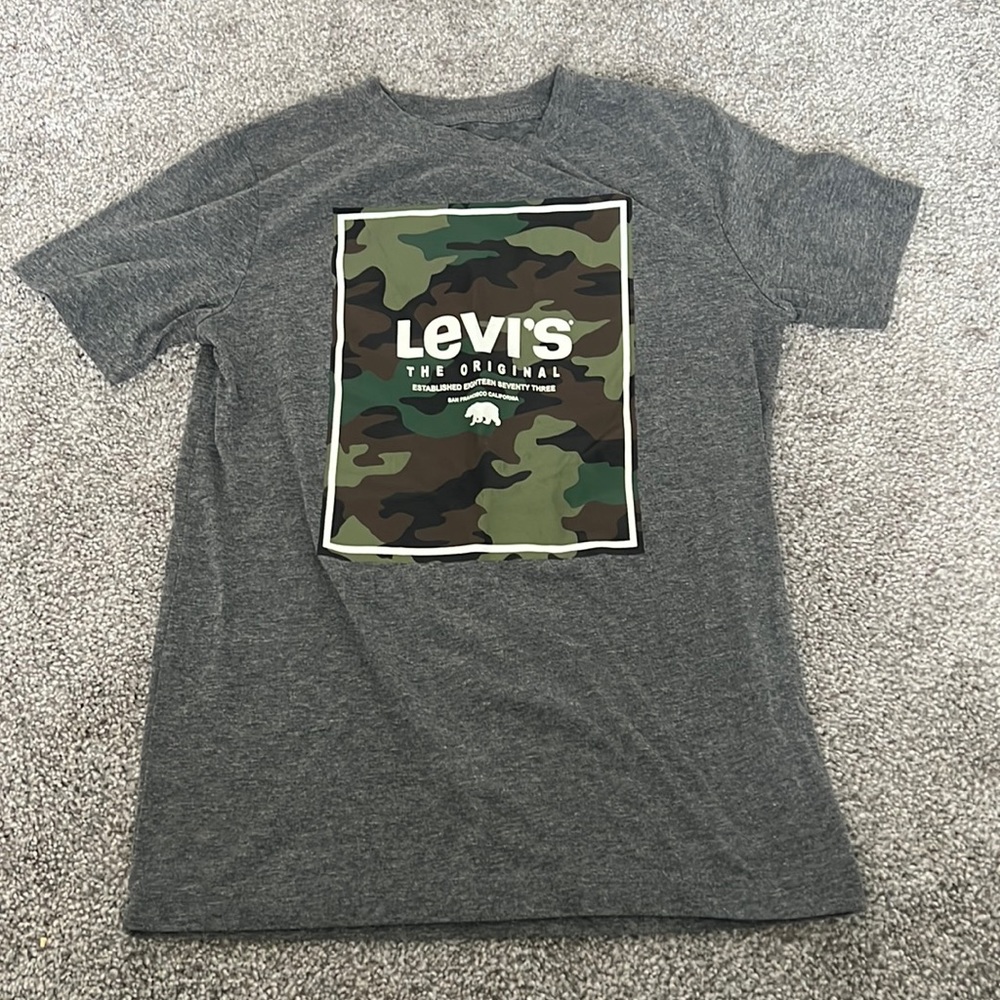 It’s Levi’s shirt size 10/12